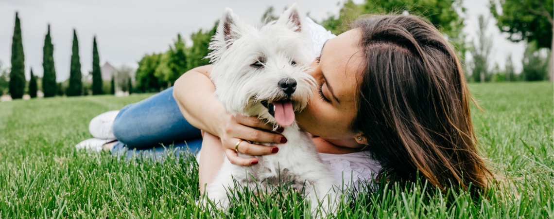 OWNER HUGGING DOG