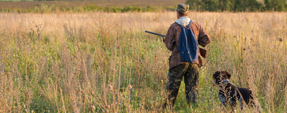 MAN AND HIS HUNTING DOG