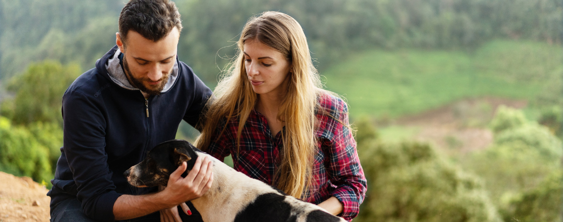 FAMILY WITH DOG OUTSIDE HOME