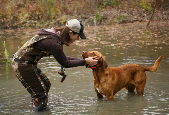 FEMALE HUNTER WITH DOG